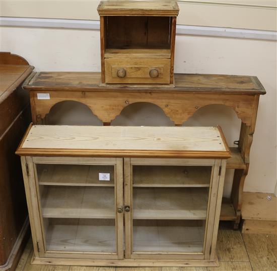 A set of pine hanging shelves and a two door glazed cupboard